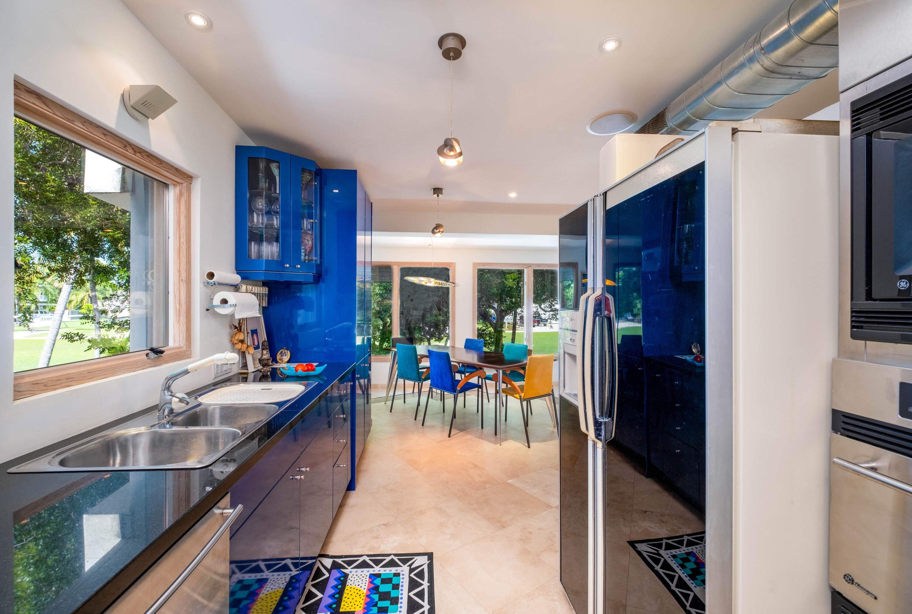 180 South Airport Road Tavernier, FL 33070 - Photo 14 of 33 a group of people sitting in kitchen and dining room