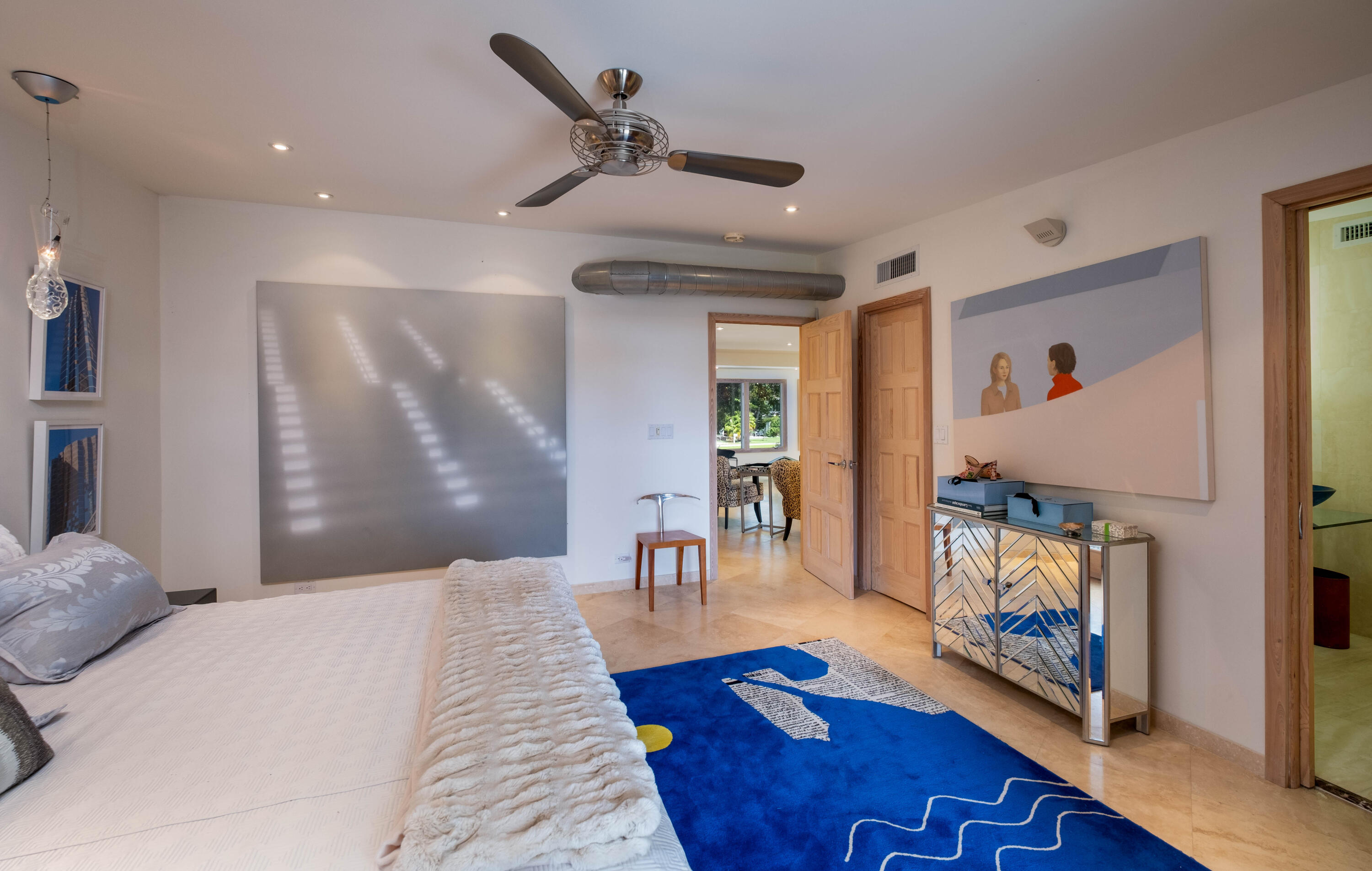 180 South Airport Road Tavernier, FL 33070 - Photo 19 of 33 a bedroom with furniture and a fireplace