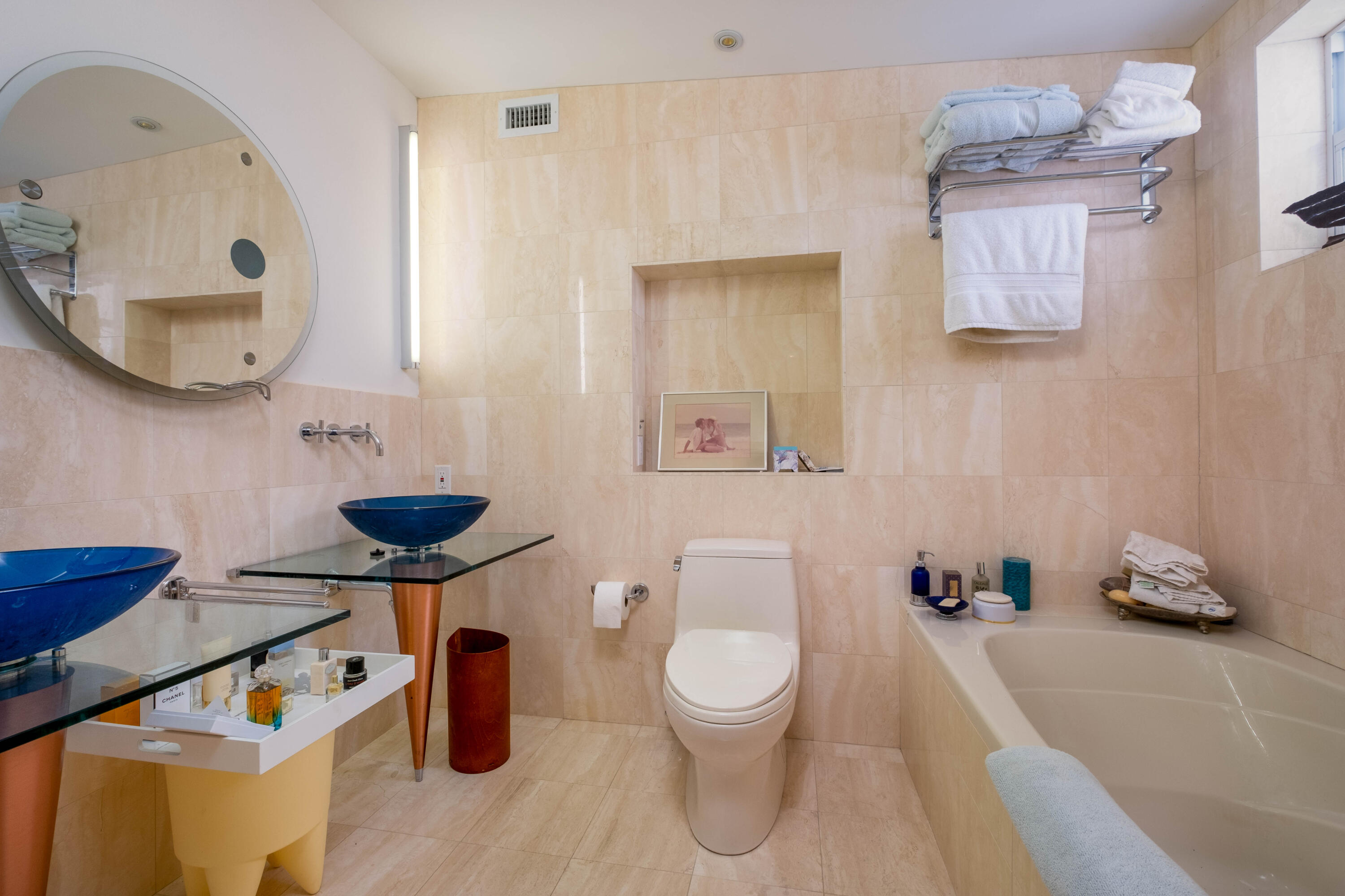 180 South Airport Road Tavernier, FL 33070 - Photo 21 of 33 a bathroom with a toilet sink and mirror