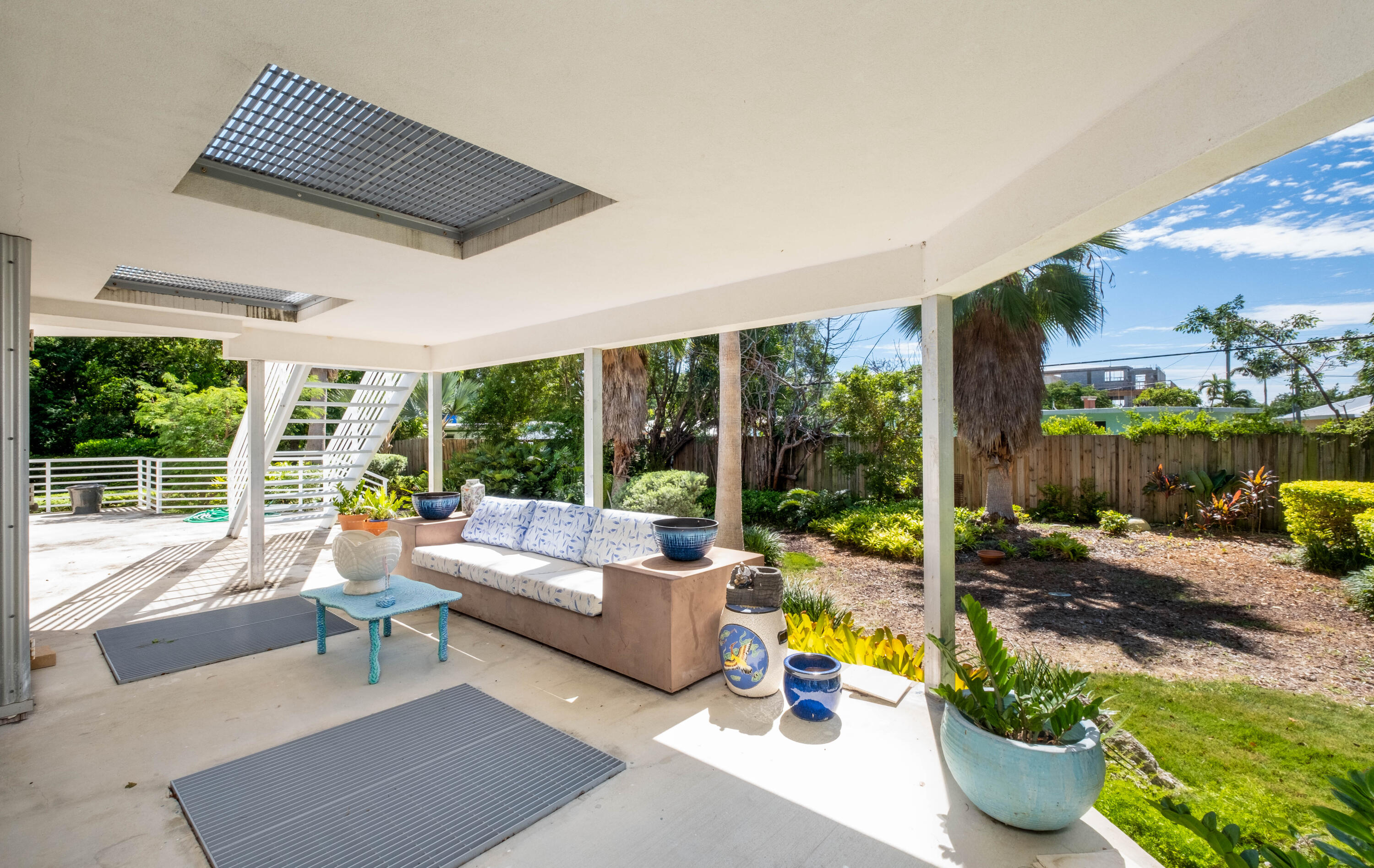 180 South Airport Road Tavernier, FL 33070 - Photo 25 of 33 a living room with furniture and a floor to ceiling window