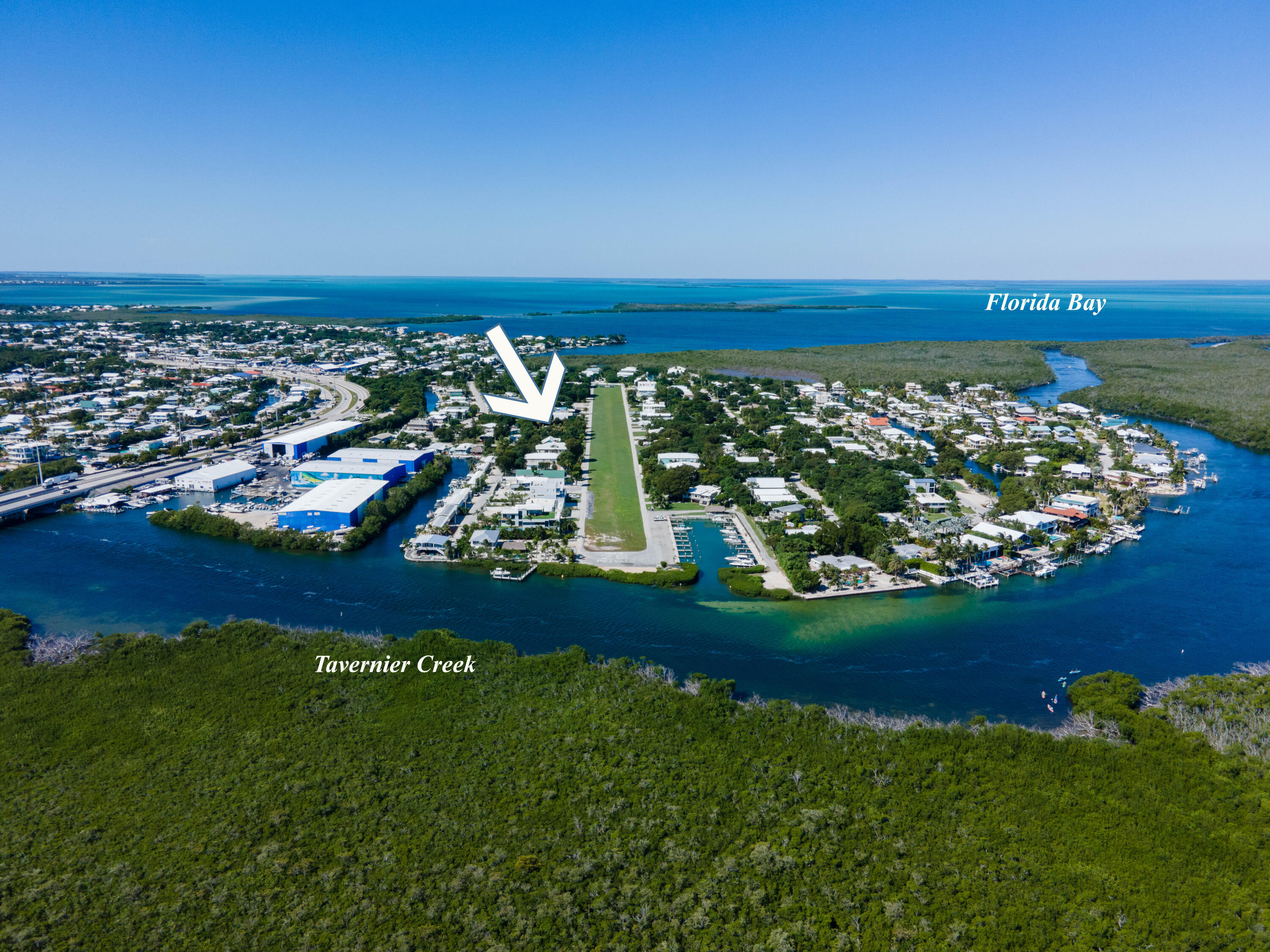 180 South Airport Road Tavernier, FL 33070 - Photo 32 of 33 a view of a golf course with a lake