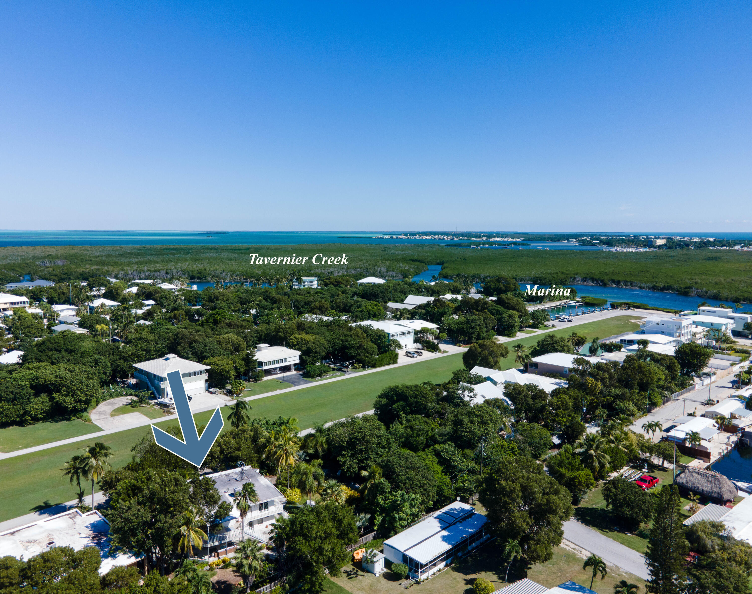 180 South Airport Road Tavernier, FL 33070 - Photo 4 of 33 an aerial view of multiple house with outdoor space