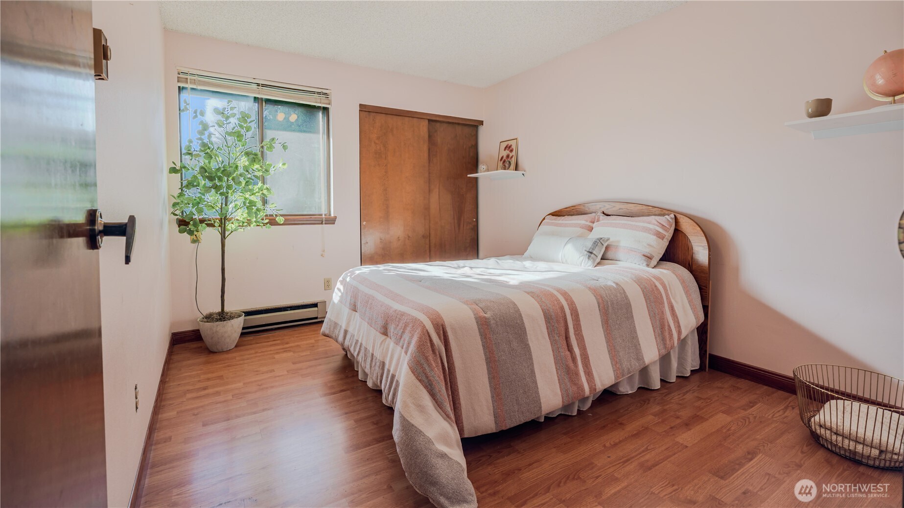 31732 47th Lane Southwest, Unit C Federal Way, WA 98023 - Photo 11 of 27 a bedroom with a bed and a window