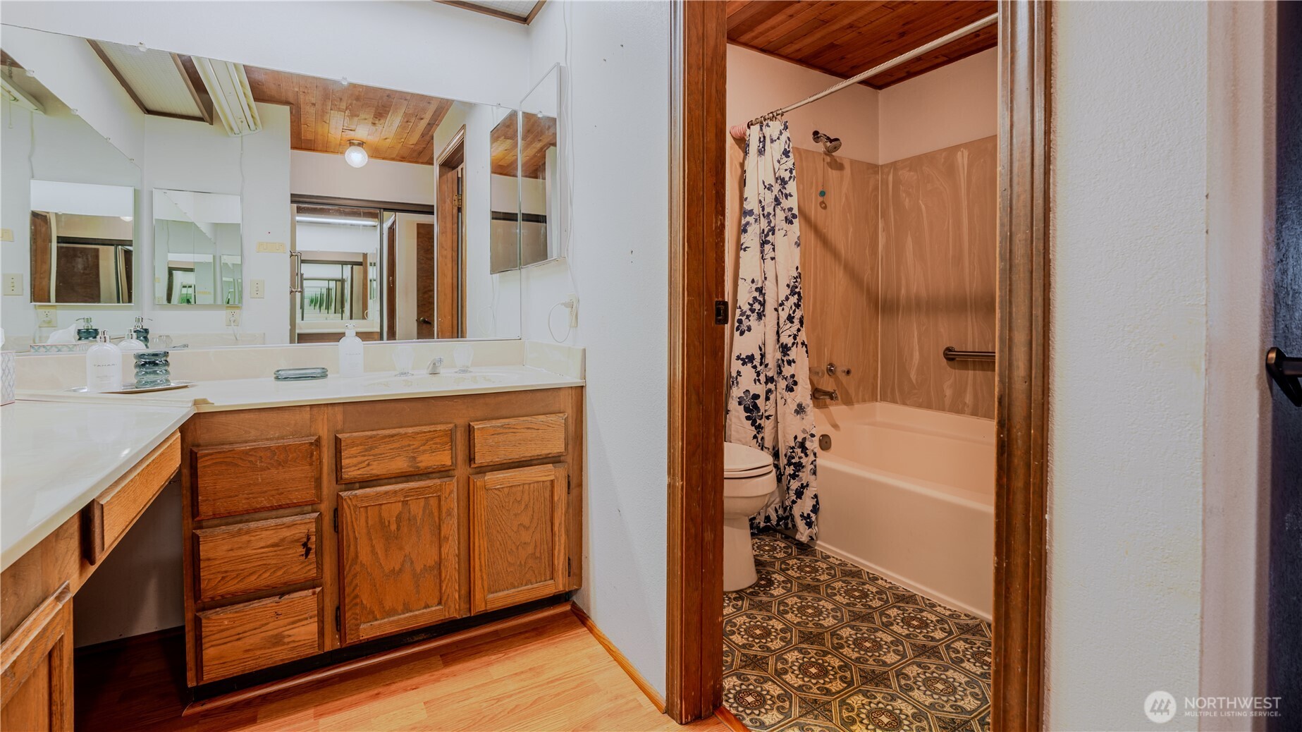 31732 47th Lane Southwest, Unit C Federal Way, WA 98023 - Photo 15 of 27 a bathroom with a granite countertop sink a mirror a bathtub and shower