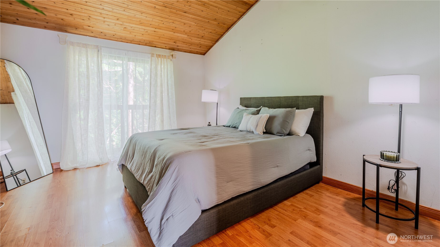 31732 47th Lane Southwest, Unit C Federal Way, WA 98023 - Photo 16 of 27 a bedroom with a bed and a window