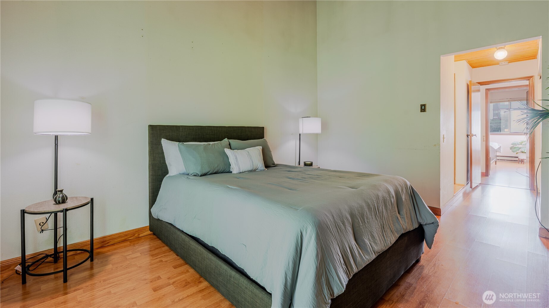 31732 47th Lane Southwest, Unit C Federal Way, WA 98023 - Photo 17 of 27 a bedroom with a bed and a lamp