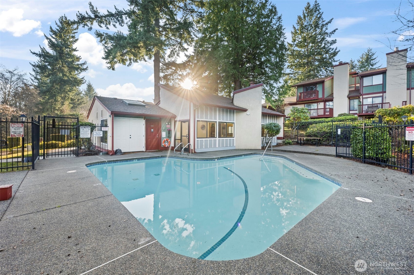 31732 47th Lane Southwest, Unit C Federal Way, WA 98023 - Photo 25 of 27 a view of a house with a swimming pool
