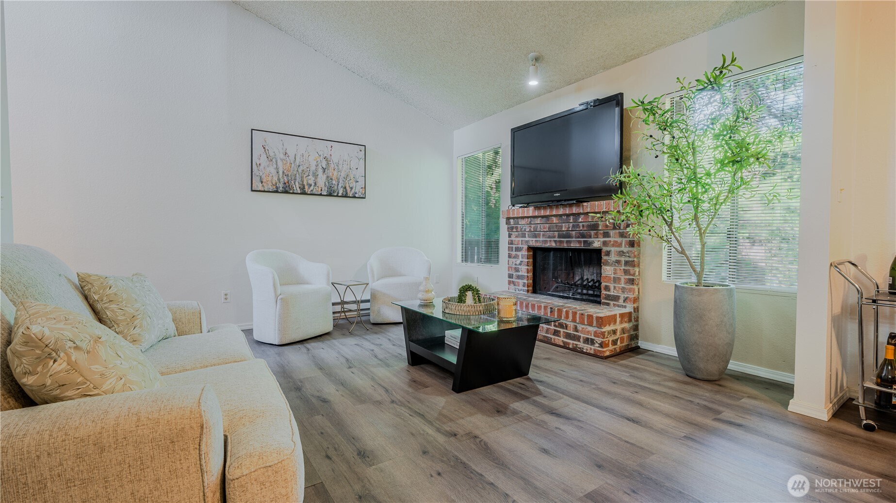 31732 47th Lane Southwest, Unit C Federal Way, WA 98023 - Photo 5 of 27 a living room with furniture fireplace and flat screen tv