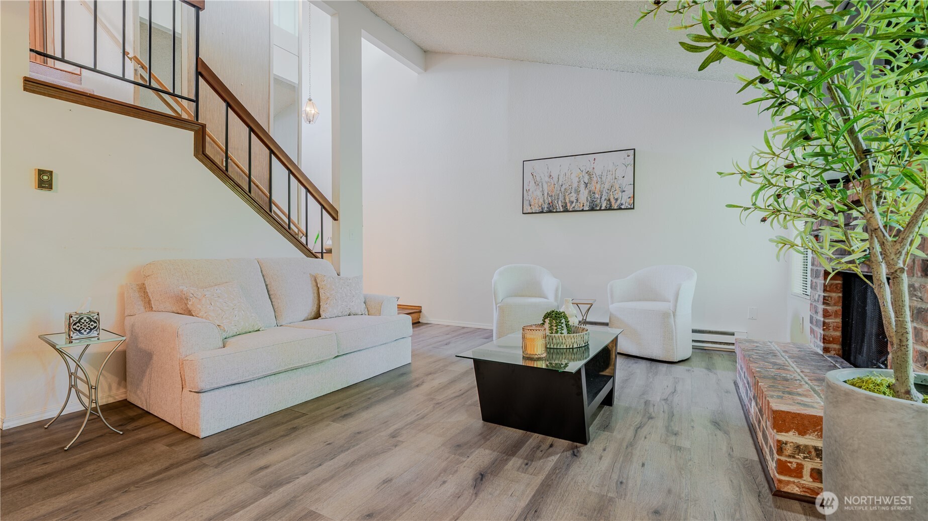 31732 47th Lane Southwest, Unit C Federal Way, WA 98023 - Photo 6 of 27 a living room with furniture and a potted plant