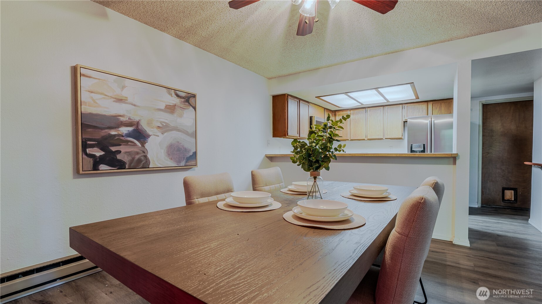 31732 47th Lane Southwest, Unit C Federal Way, WA 98023 - Photo 7 of 27 a view of a dining room with furniture and wooden floor