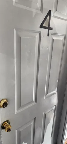 a bathroom with a shower and a mirror