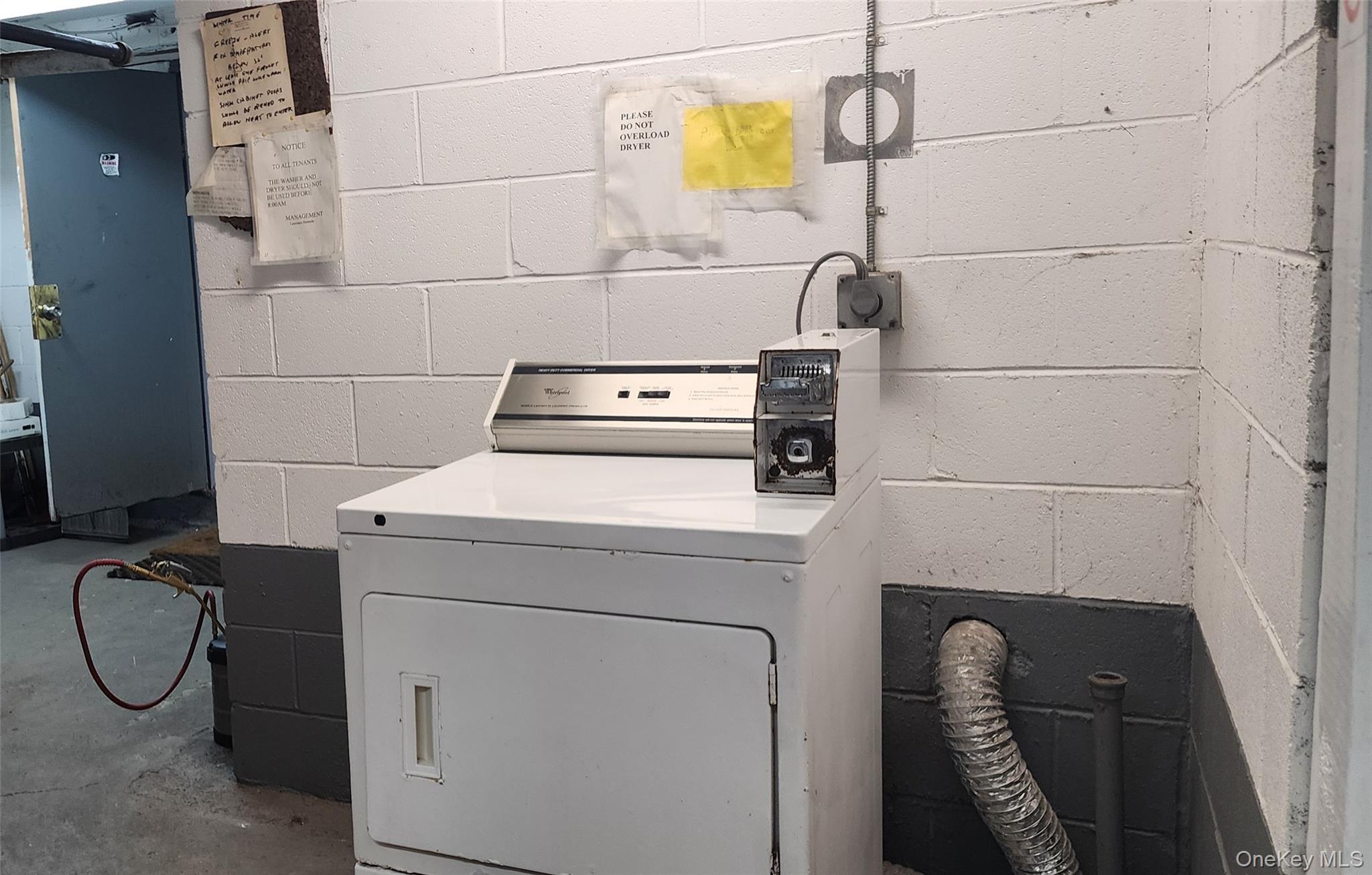 Undisclosed Address Monticello, NY 12701 - Photo 6 of 7 a utility room with dryer and washer
