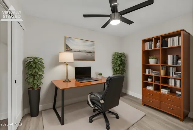 a view of a workspace with furniture