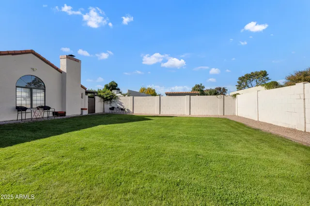 a view of a backyard with garden
