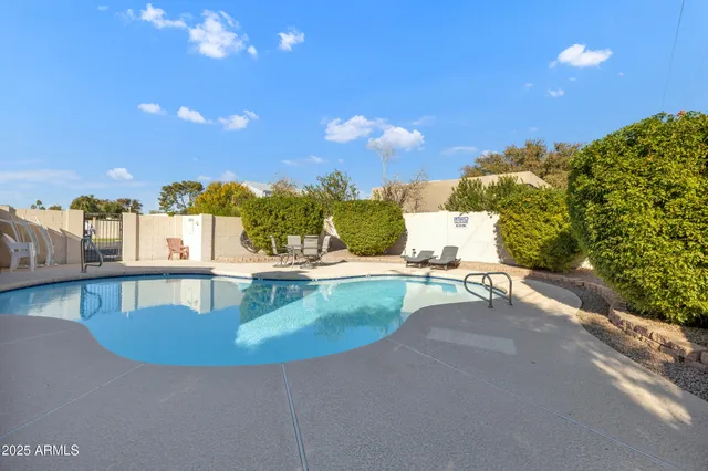 a view of a swimming pool with a patio