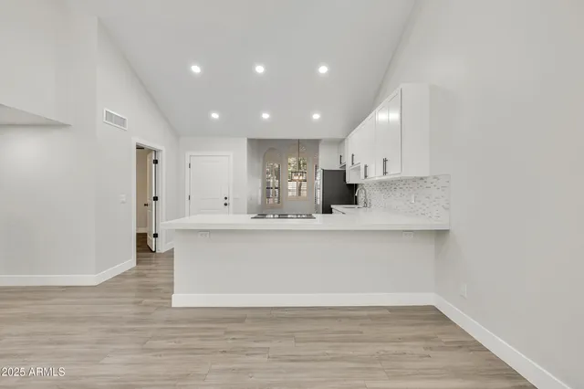 a view of kitchen with wooden floor