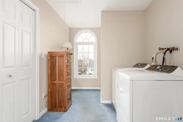 an aerial view of a house with a garden and swimming pool