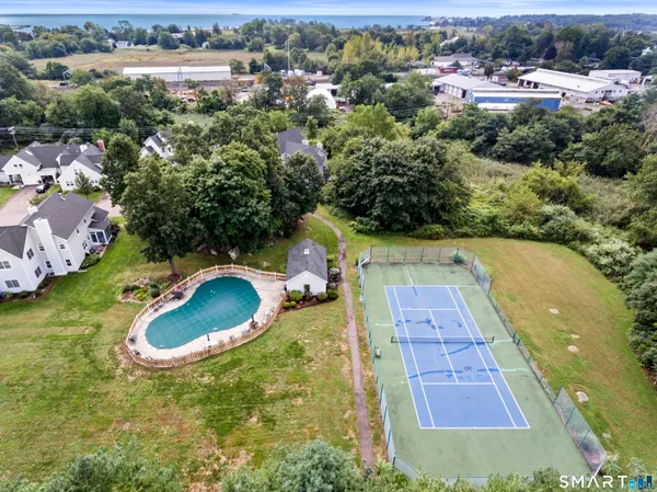 an aerial view of a house with a yard