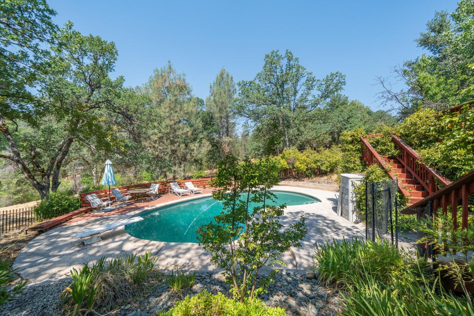 8846 Goldstone Lane Redding, CA 96001 - Photo 57 of 64 a backyard of a house with lots of green space
