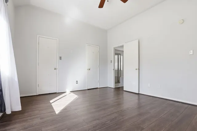 an empty room with wooden floor