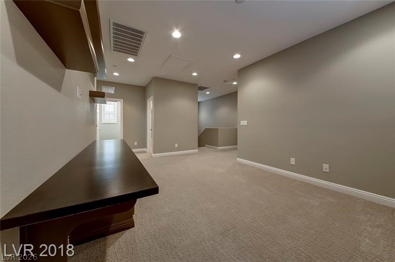 3144 Whitfeild Avenue Henderson, NV 89044 - Photo 17 of 55 A versatile open loft area provides ample space for relaxation or recreation.