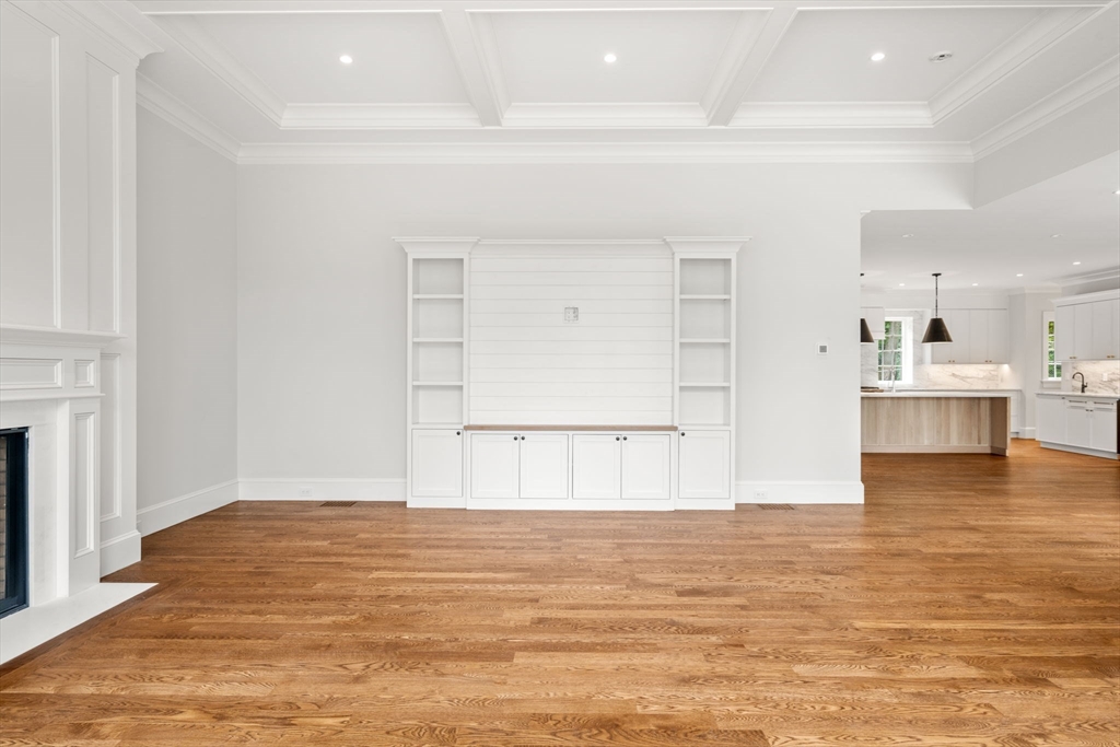 61 Heath Street Brookline, MA 02467 - Photo 11 of 40 a view of kitchen and empty room with wooden floor