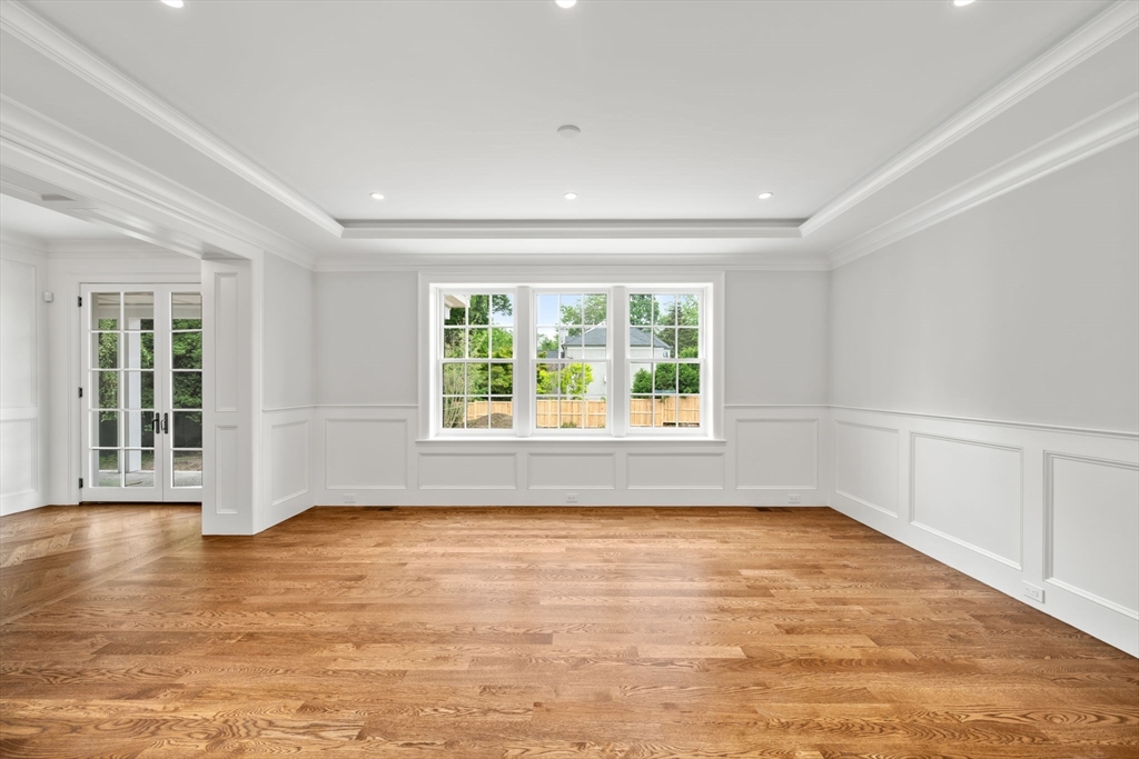 61 Heath Street Brookline, MA 02467 - Photo 12 of 40 wooden floor in an empty room with a window
