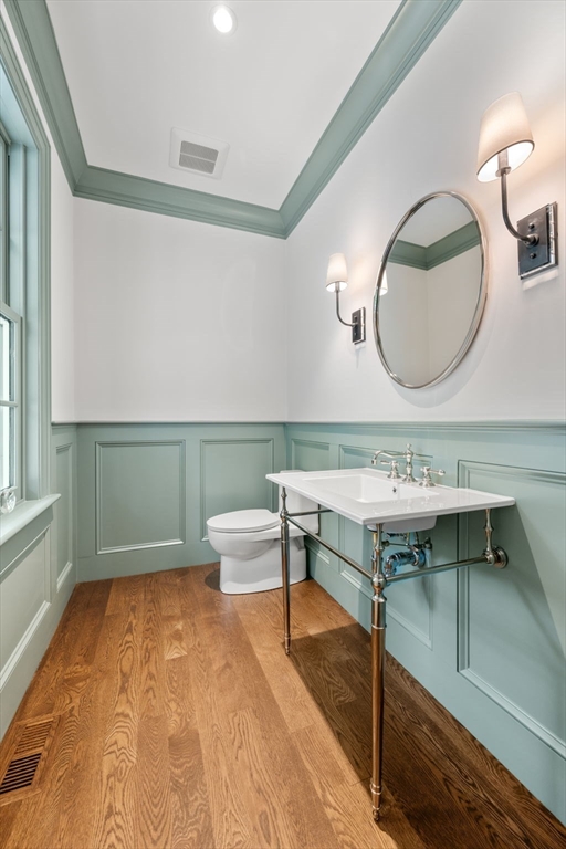 61 Heath Street Brookline, MA 02467 - Photo 16 of 40 a view of a room with wooden floor sink and cabinet