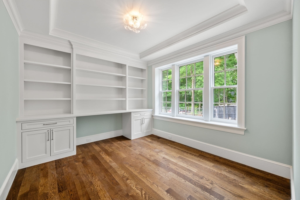 61 Heath Street Brookline, MA 02467 - Photo 17 of 40 a bedroom with a bed and a window