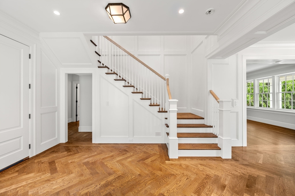 61 Heath Street Brookline, MA 02467 - Photo 21 of 40 a view of entryway and hall with wooden floor
