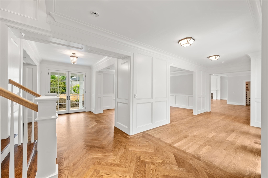 61 Heath Street Brookline, MA 02467 - Photo 23 of 40 a view of a hallway with wooden floor and windows