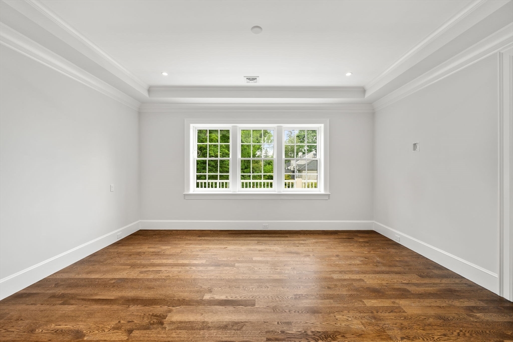 61 Heath Street Brookline, MA 02467 - Photo 25 of 40 wooden floor in an empty room with a window