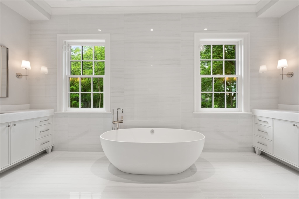 61 Heath Street Brookline, MA 02467 - Photo 27 of 40 a bathroom with a bathtub and window