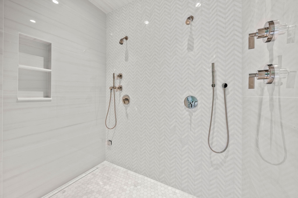 61 Heath Street Brookline, MA 02467 - Photo 28 of 40 a bathroom with a bath tub