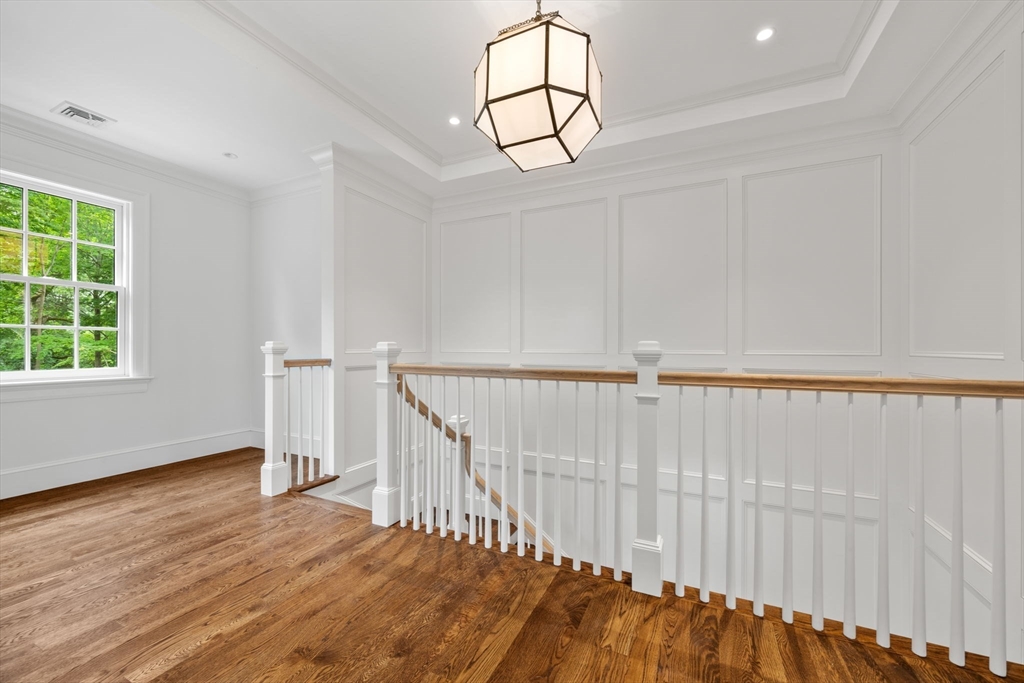 61 Heath Street Brookline, MA 02467 - Photo 29 of 40 a view of entryway with wooden floor