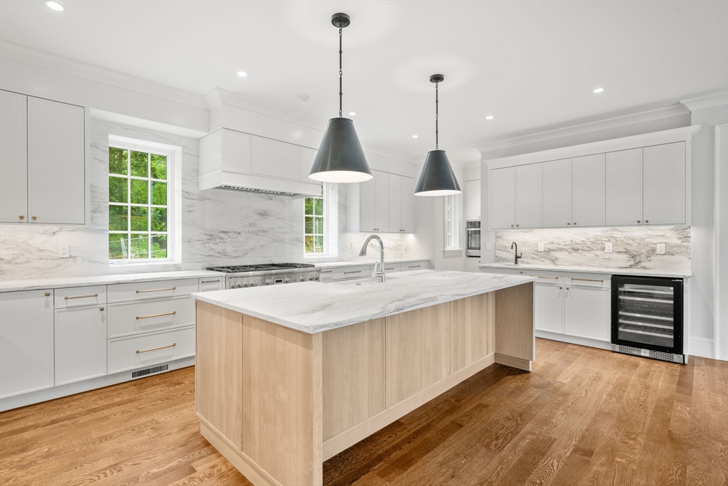 61 Heath Street Brookline, MA 02467 - Photo 3 of 40 a kitchen with kitchen island granite countertop a sink appliances and cabinets