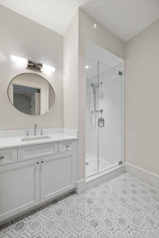 61 Heath Street Brookline, MA 02467 - Photo 31 of 40 a bathroom with a sink a toilet and shower