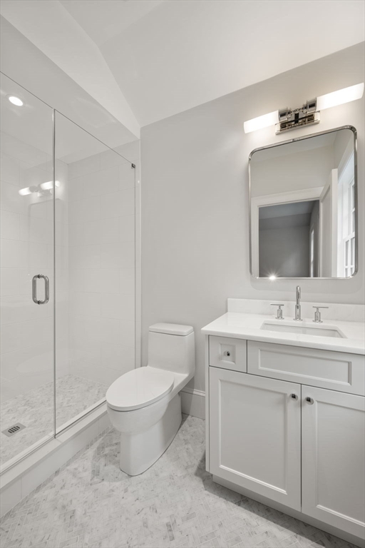61 Heath Street Brookline, MA 02467 - Photo 33 of 40 a bathroom with a toilet sink and mirror