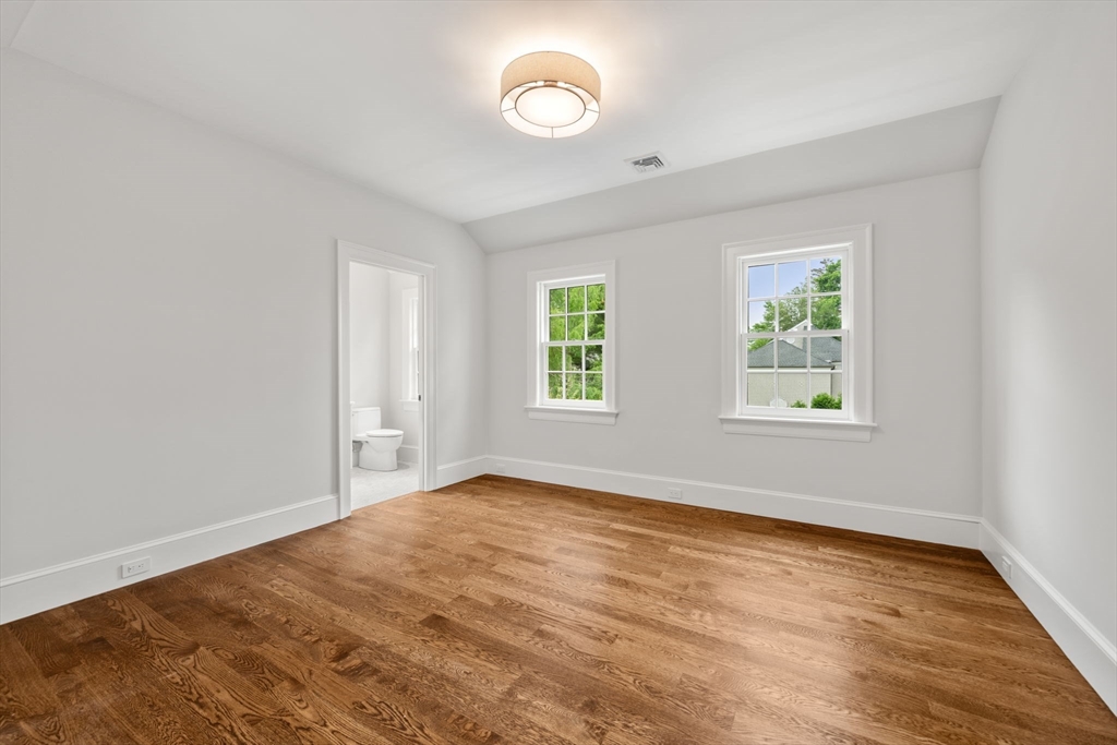 61 Heath Street Brookline, MA 02467 - Photo 34 of 40 wooden floor in an empty room with a window