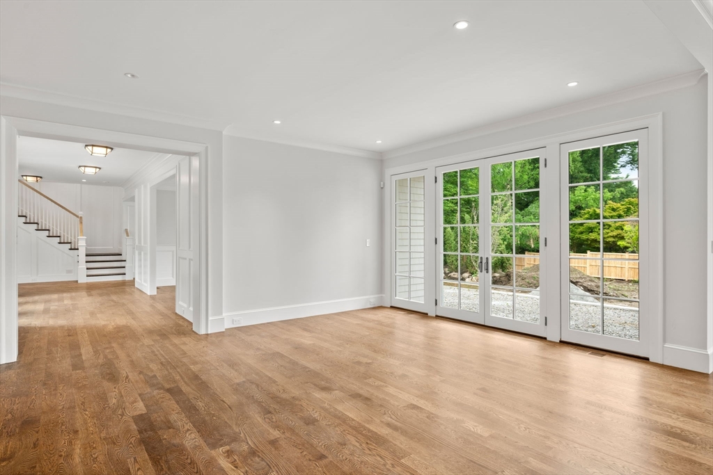 61 Heath Street Brookline, MA 02467 - Photo 7 of 40 a view of empty room with wooden floor and fan