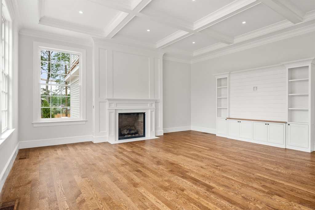 61 Heath Street Brookline, MA 02467 - Photo 9 of 40 a view of empty room with wooden floor and fan