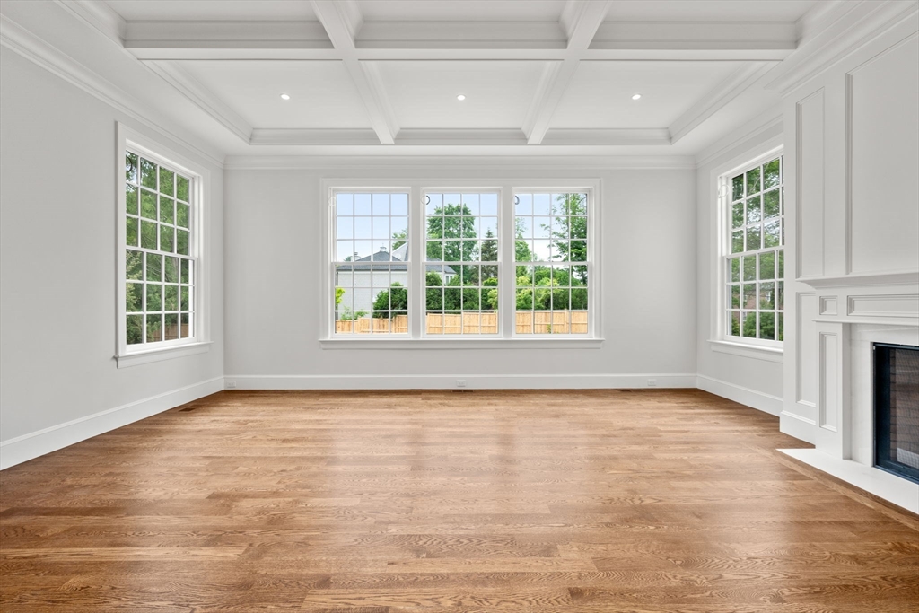 61 Heath Street Brookline, MA 02467 - Photo 10 of 40 a view of an empty room with a window and wooden floor