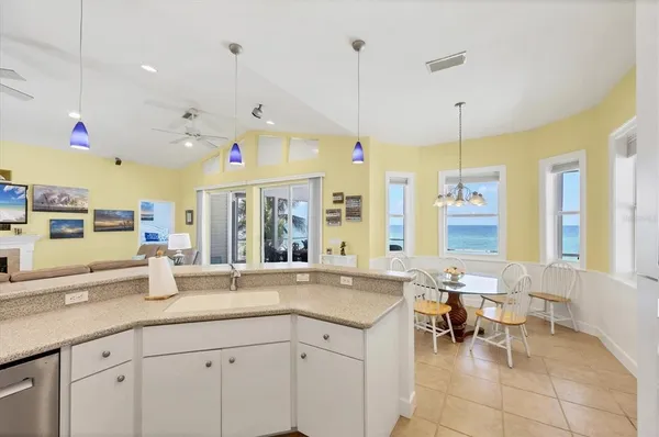 a dining room with furniture and window