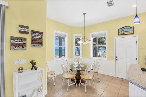 a dining room with furniture and window