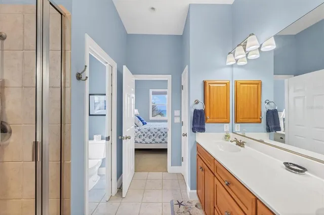 a bathroom with a tub sink and mirror
