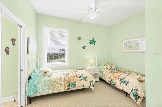 a bedroom with a bed and a wall painting