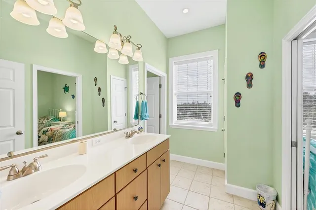 a bathroom with a toilet and a shower curtain