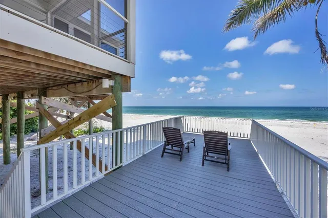 a view of sitting area with furniture and wooden floor