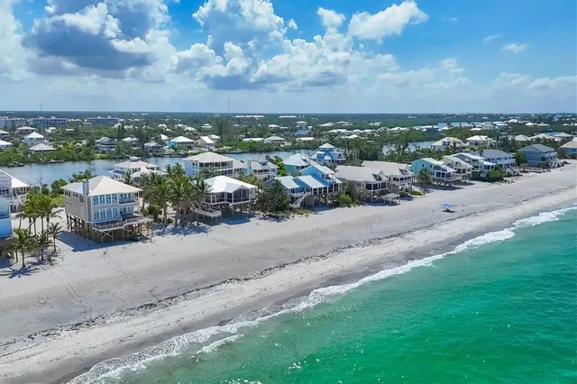 an aerial view of a house with a garden and yard