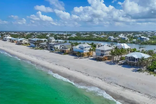an aerial view of a city with lake view